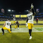 
              Pittsburgh Steelers safety Damontae Kazee (23) and linebacker Robert Spillane (41) celebrate an interception by safety Minkah Fitzpatrick, center, against the Baltimore Ravens in an NFL football game in Baltimore, Fla., Sunday, Jan. 1, 2023. (AP Photo/Julio Cortez)
            