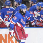 
              New York Rangers' Mika Zibanejad (93) celebrates with teammates after scoring a goal during the third period of an NHL hockey game against the Florida Panthers, Monday, Jan. 23, 2023, in New York. (AP Photo/Frank Franklin II)
            