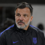 
              United States interim head coach Anthony Hudson stands on the sideline before an international friendly soccer match against Serbia in Los Angeles, Wednesday, Jan. 25, 2023. (AP Photo/Ashley Landis)
            