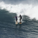 
              Shane Dorian, left, and Peter Mel share a ride on a large wave during The Eddie Aikau Big Wave Invitational at Waimea Bay on Sunday, Jan. 22, 2023, on Oahu's North Shore, in Hawaii. (Jamm Aquino/Honolulu Star-Advertiser via AP)
            