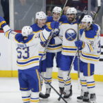 
              Buffalo Sabres' Jeff Skinner (53), Rasmus Dahlin (26), Tage Thompson (72), Alex Tuch (89) and Kale Clague (38) celebrate Thompson's goal against the Winnipeg Jets during the second period of an NHL hockey game Thursday, Jan. 26, 2023, in Winnipeg, Manitoba. (John Woods/The Canadian Press via AP)
            