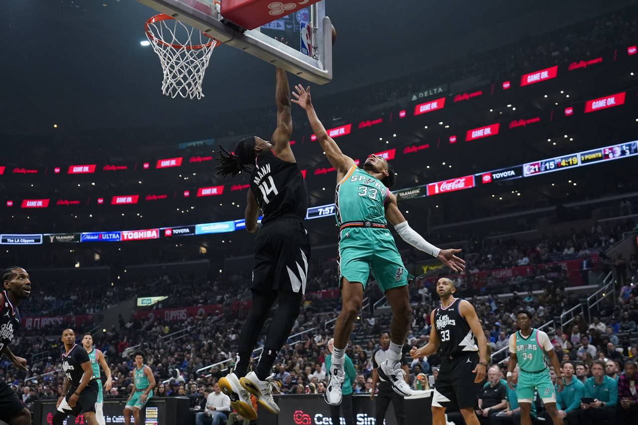 Los Angeles Clippers guard Terance Mann (14) blocks a shot by San Antonio Spurs guard Tre Jones (33...