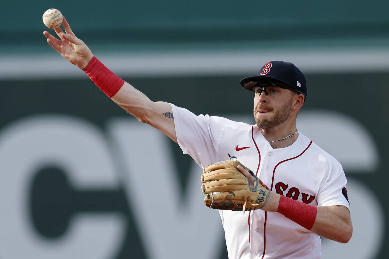 FILE - Boston Red Sox's Trevor Story throws to first base on the force out single by Texas Rangers'...