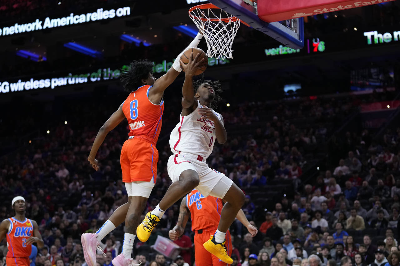 Philadelphia 76ers' Tyrese Maxey (0) goes up for a shot against Oklahoma City Thunder's Jalen Willi...