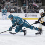 
              San Jose Sharks defenseman Matt Benning (5) is tripped by Boston Bruins left wing Taylor Hall (71) during the second period of an NHL hockey game Saturday, Jan. 7, 2023, in San Jose, Calif. (AP Photo/Tony Avelar)
            