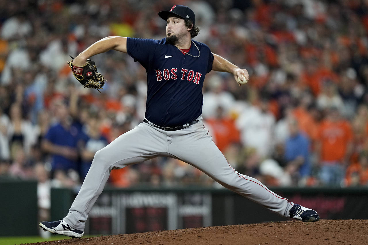 FILE - Boston Red Sox relief pitcher Josh Taylor throws against the Houston Astros during the fifth...