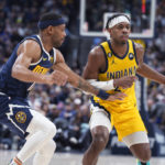 
              Indiana Pacers guard Buddy Hield, right, is defended by Denver Nuggets forward Bruce Brown during the first half of an NBA basketball game Friday, Jan. 20, 2023, in Denver. (AP Photo/David Zalubowski)
            
