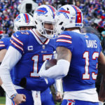 
              Buffalo Bills wide receiver Gabe Davis (13), right, is congratulated by quarterback Josh Allen after his touchdown catch during the second half of an NFL wild-card playoff football game against the Miami Dolphins, Sunday, Jan. 15, 2023, in Orchard Park, N.Y. (AP Photo/Jeffrey T. Barnes)
            