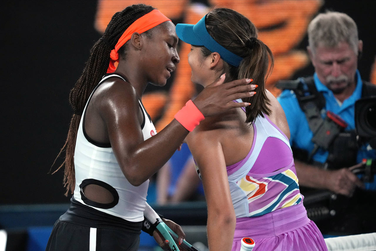 Coco Gauff, left, of the U.S. is congratulated by Emma Raducanu of Britain following their second r...