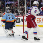 
              New York Rangers center Mika Zibanejad reacts after scoring a goal against Florida Panthers goaltender Sergei Bobrovsky (72) during the first period of an NHL hockey game, Sunday, Jan. 1, 2023, in Sunrise, Fla. (AP Photo/Lynne Sladky)
            