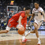 
              St. John's Rafael Pinzon, left, drives to the basket as UConn's Jordan Hawkins defends in the second half of an NCAA college basketball game, Sunday, Jan. 15, 2023, in Hartford, Conn. (AP Photo/Jessica Hill)
            