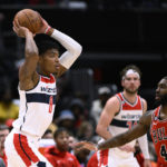 
              Washington Wizards forward Rui Hachimura (8) looks to pass against Chicago Bulls forward Patrick Williams (44) during the first half of an NBA basketball game Wednesday, Jan. 11, 2023, in Washington. (AP Photo/Nick Wass)
            