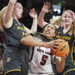 
              South Carolina forward Victaria Saxton (5) battles in the paint against Missouri guard Haley Troup, left, and Haley Frank, right, during the first half of an NCAA college basketball game, Sunday, Jan. 15, 2023, in Columbia, S.C. (AP Photo/Sean Rayford)
            