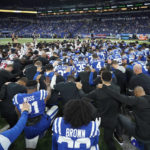 
              The Houston Texans and Indianapolis Colts gather on the field before their NFL football game in support of Buffalo Bills safety Damar Hamlin, Sunday, Jan. 8, 2023, in Indianapolis. (AP Photo/Darron Cummings)
            