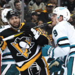 
              Pittsburgh Penguins' Jason Zucker (16) collides with San Jose Sharks' Jacob MacDonald during the second period of an NHL hockey game in Pittsburgh, Saturday, Jan. 28, 2023. (AP Photo/Gene J. Puskar)
            