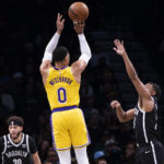 
              Los Angeles Lakers guard Russell Westbrook (0) shoots over Brooklyn Nets guard Cam Thomas, right, during the first half of an NBA basketball game Monday, Jan. 30, 2023, in New York. (AP Photo/Corey Sipkin)
            