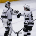 
              Los Angeles Kings goaltender Pheonix Copley, left, celebrates with defenseman Sean Durzi after the Kingsy defeated the Chicago Blackhawks in an NHL hockey game in Chicago, Sunday, Jan. 22, 2023. (AP Photo/Nam Y. Huh)
            