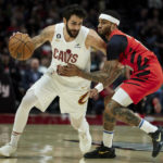 
              Cleveland Cavaliers guard Ricky Rubio, left, dribbles around Portland Trail Blazers guard Gary Payton II during the first half of an NBA basketball game in Portland, Ore., Thursday, Jan. 12, 2023. (AP Photo/Craig Mitchelldyer)
            