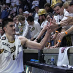
              Purdue center Zach Edey (15) greets fans as he leaves the floor following an NCAA college basketball game against Michigan State in West Lafayette, Ind., Sunday, Jan. 29, 2023. Purdue defeated Michigan State 77-61. (AP Photo/Michael Conroy)
            