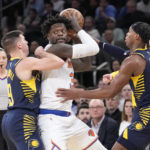 
              Indiana Pacers guard T.J. McConnell (9) and guard Buddy Hield (24) guard New York Knicks forward Julius Randle in the second half of an NBA basketball game, Wednesday, Jan. 11, 2023, at Madison Square Garden in New York. (AP Photo/Mary Altaffer)
            