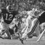 
              FILE - Southern California tailback Charles White carries against Michigan during the Rose Bowl NCAA college football game in Pasadena, Calif.,  Jan. 1, 1979. White died Wednesday, Jan. 11, 2023. He was 64. USC announced the death of White, who is still the Trojans' career rushing leader with 6,245 yards. The nine-year NFL veteran died of cancer, the school said. (AP Photo, File)
            