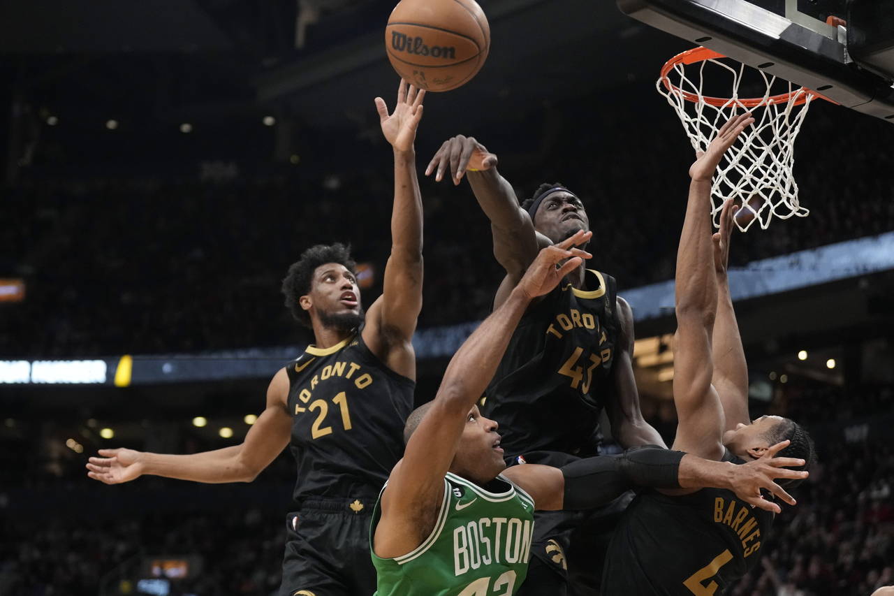 Toronto Raptors forward Pascal Siakam (43) blocks a shot by Boston Celtics centerAl Horford, bottom...