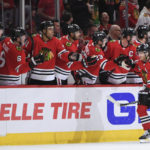 
              Chicago Blackhawks' Patrick Kane (88) celebrates with teammates at the bench after scoring during the second period of an NHL hockey game against the San Jose Sharks, Sunday, Jan. 1, 2023, in Chicago. (AP Photo/Paul Beaty)
            