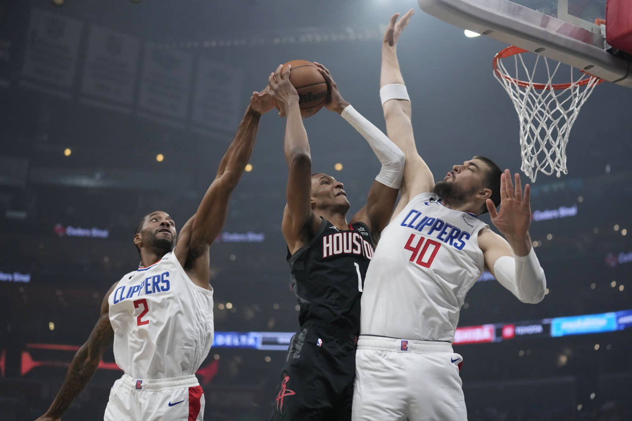 Houston Rockets forward Jabari Smith Jr. (1) is fouled by Los Angeles Clippers center Ivica Zubac (...