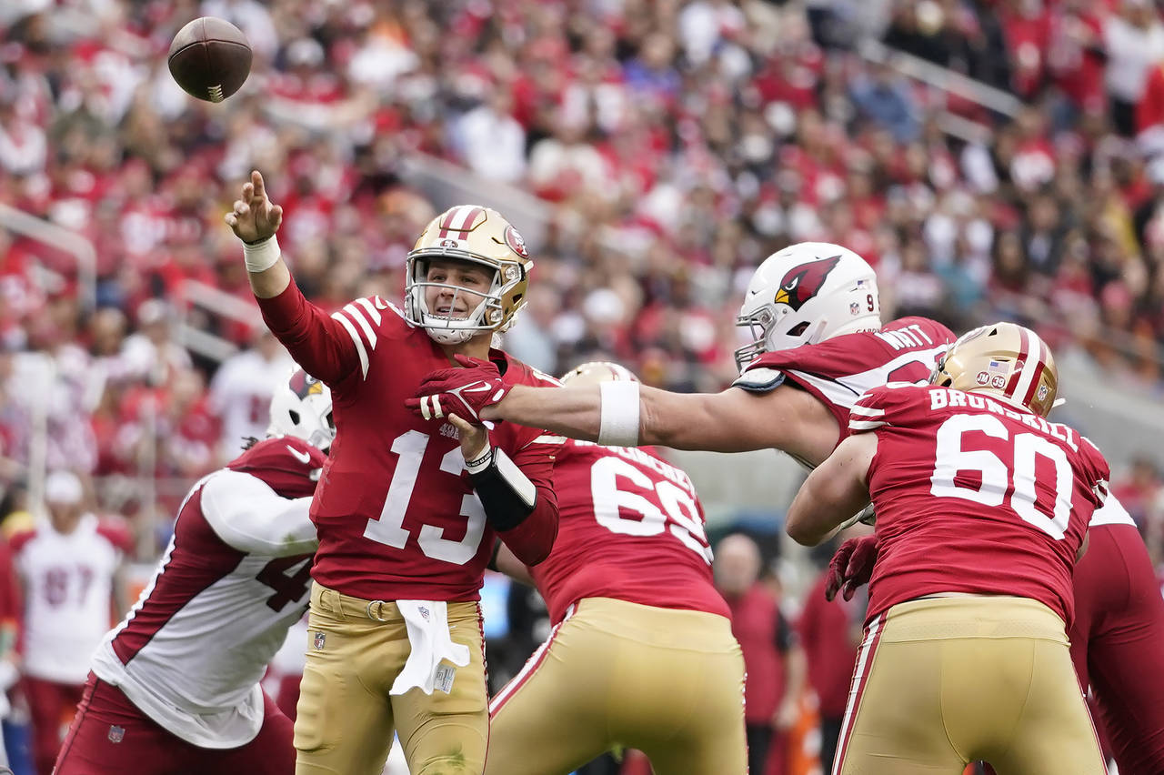 San Francisco 49ers quarterback Brock Purdy (13) throws a touchdown pass during the first half of a...