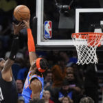 
              Oklahoma City Thunder's Shai Gilgeous-Alexander, right, blocks a shot attempt by Orlando Magic's Terrence Ross (31) during the first half of an NBA basketball game Wednesday, Jan. 4, 2023, in Orlando, Fla. (AP Photo/John Raoux)
            