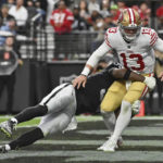 
              San Francisco 49ers quarterback Brock Purdy (13) is tackled by Las Vegas Raiders defensive end Isaac Rochell (95) during the first half of an NFL football game between the San Francisco 49ers and Las Vegas Raiders, Sunday, Jan. 1, 2023, in Las Vegas. (AP Photo/David Becker)
            
