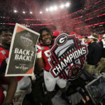 
              Georgia players celebrate a win over TCU after the national championship NCAA College Football Playoff game, Monday, Jan. 9, 2023, in Inglewood, Calif. Georgia won 65-7. (AP Photo/Ashley Landis)
            