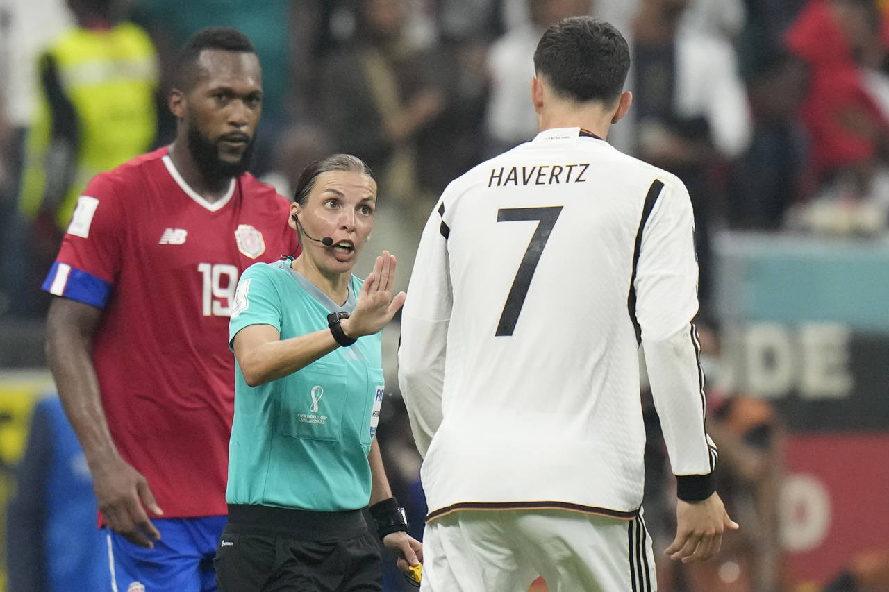 FILE - Referee Stephanie Frappart talks with Germany's Kai Havertz during the World Cup group E soc...