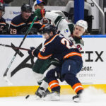
              Minnesota Wild's Kirill Kaprizov (97) fights for control of the puck against New York Islanders' Sebastian Aho (25) during the third period of an NHL hockey game Thursday, Jan. 12, 2023, in Elmont, N.Y. The Wild won 3-1. (AP Photo/Frank Franklin II)
            