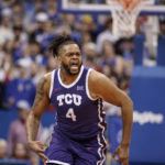 
              TCU center Eddie Lampkin Jr. (4) celebrates during a TCU run against Kansas during the first half of an NCAA college basketball game on Saturday, Jan. 21, 2023, at Allen Fieldhouse in Lawrence, Kan. (AP Photo/Nick Krug)
            