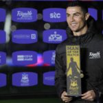 
              Cristiano Ronaldo holds a trophy as a 'Man of the match' after playing a friendly soccer match for a combined XI of Saudi Arabian teams Al Nassr and Al Hilal against PSG, at the King Saud University Stadium, in Riyadh, Saudi Arabia, Thursday, Jan. 19, 2023. (AP Photo/Hussein Malla)
            