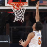 
              New York Knicks guard Quentin Grimes scores during the second half of an NBA basketball game against the Atlanta Hawks, Friday, Jan. 20, 2023, in Atlanta. (AP Photo/Hakim Wright Sr.)
            