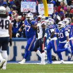 
              Buffalo Bills running back Nyheim Hines (20) celebrates with his teammates after scoring on a kickoff return during the first half of an NFL football game against the New England Patriots, Sunday, Jan. 8, 2023, in Orchard Park. (AP Photo/Adrian Kraus)
            