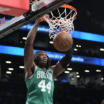 
              Boston Celtics center Robert Williams III dunks during the first half of the team's NBA basketball game against the Brooklyn Nets, Thursday, Jan. 12, 2023, in New York. (AP Photo/Mary Altaffer)
            
