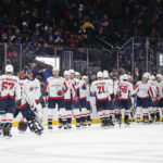 
              The Washington Capitals celebrate after the winning goal by Dmitry Orlov following an NHL hockey game against the New York Islanders, Monday, Jan. 16, 2023, in Elmont, N.Y. The Capitals won 4-3 in overtime. (AP Photo/Frank Franklin II)
            