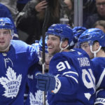
              Toronto Maple Leafs players celebrate after a goal by teammate Calle Jarnkrok, right, against the New York Islanders during second-period NHL hockey game action in Toronto, Ontario, Monday, Jan. 23, 2023. (Nathan Denette/The Canadian Press via AP)
            