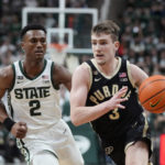 
              Purdue guard Braden Smith (3) brings the ball up court as Michigan State guard Tyson Walker (2) defends during the first half of an NCAA college basketball game, Monday, Jan. 16, 2023, in East Lansing, Mich. (AP Photo/Carlos Osorio)
            