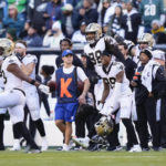 
              The New Orleans Saints bench reacts after stopping the Philadelphia Eagles on fourth down in the second half of an NFL football game in Philadelphia, Sunday, Jan. 1, 2023. (AP Photo/Matt Slocum)
            