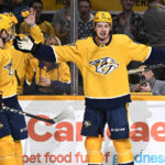 
              Nashville Predators center Cody Glass (8) celebrates with left wing Filip Forsberg (9) after Glass scored a goal against the Winnipeg Jets during the second period of an NHL hockey game Tuesday, Jan. 24, 2023, in Nashville, Tenn. (AP Photo/Mark Zaleski)
            