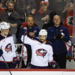 
              Columbus Blue Jackets forward Johnny Gaudreau (13) waves to fans on his return to Calgary during first-period NHL hockey game action against the Calgary Flames in Calgary, Alberta, Monday, Jan. 23, 2023. (Jeff McIntosh/The Canadian Press via AP)
            