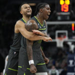 
              Minnesota Timberwolves forward Nathan Knight, right, celebrates with forward Kyle Anderson after making a 3-point basket during the second half of an NBA basketball game against the Houston Rockets, Saturday, Jan. 21, 2023, in Minneapolis. (AP Photo/Abbie Parr)
            
