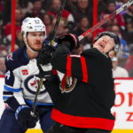 
              Ottawa Senators left wing Brady Tkachuk (7) reacts after a stick-check by Winnipeg Jets defenseman Dylan Samberg (54) during second-period NHL hockey game action in Ottawa, Ontario, Saturday, Jan. 21, 2023. (Sean Kilpatrick/The Canadian Press via AP)
            