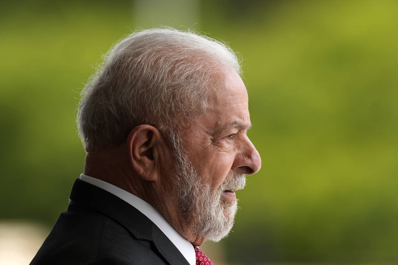 Brazil's President Luiz Inacio Lula da Silva  waits for the arrival of the German Chancellor Olaf S...
