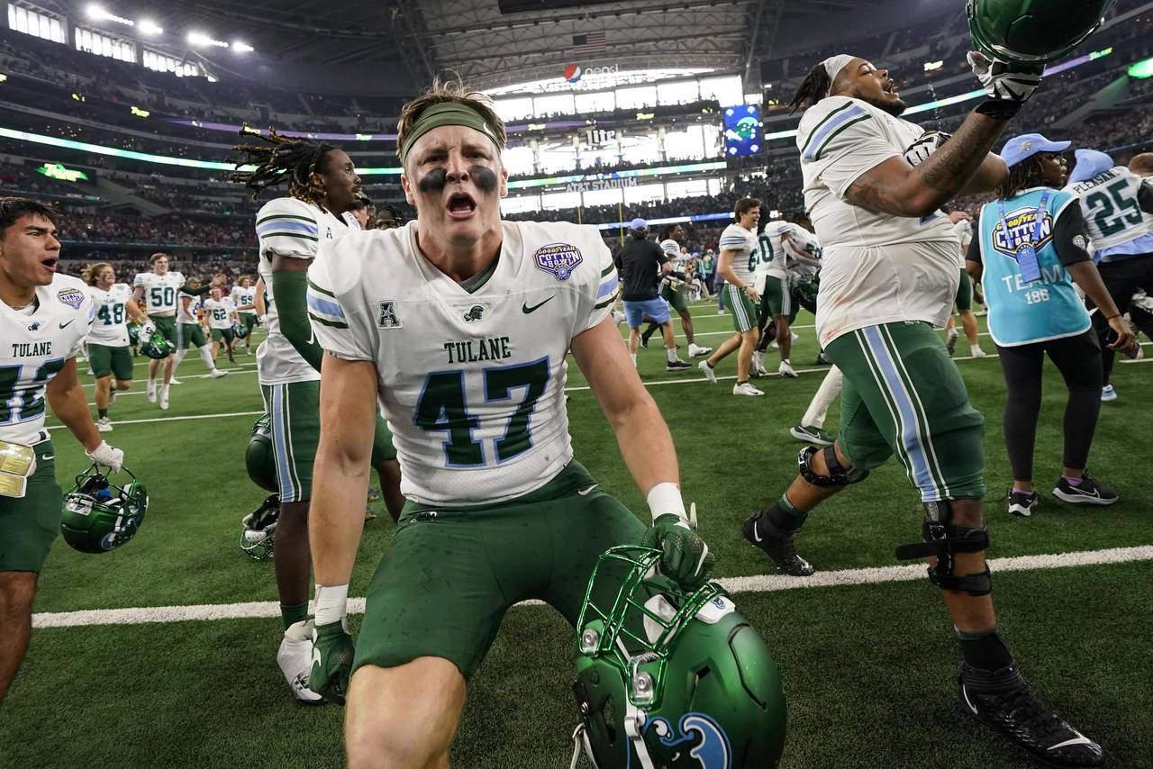 Tulane linebacker Aidan McCahill (47) celebrates after the Cotton Bowl NCAA college football game a...