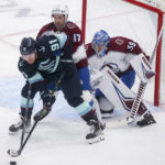 
              Seattle Kraken right wing Daniel Sprong (91) tries to field the puck in front of Colorado Avalanche's Brad Hunt (17) and Pavel Francouz (39) during the first period of an NHL hockey game Saturday, Jan. 21, 2023, in Seattle. (AP Photo/Lindsey Wasson)
            